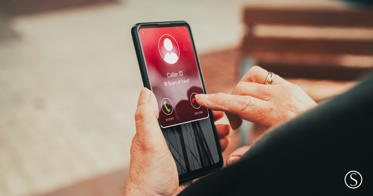 Older adult pausing to review an unexpected message on a smartphone before responding